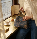 The Bridle Crest Slouch Handbag